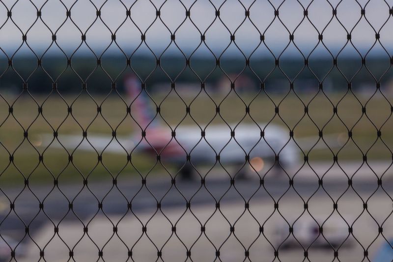 Full frame shot of chainlink fence against sky