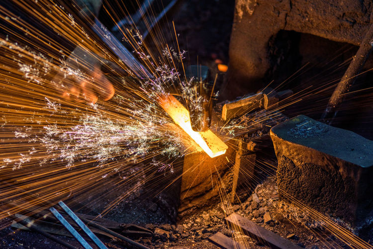 High angle view of metal with sparks