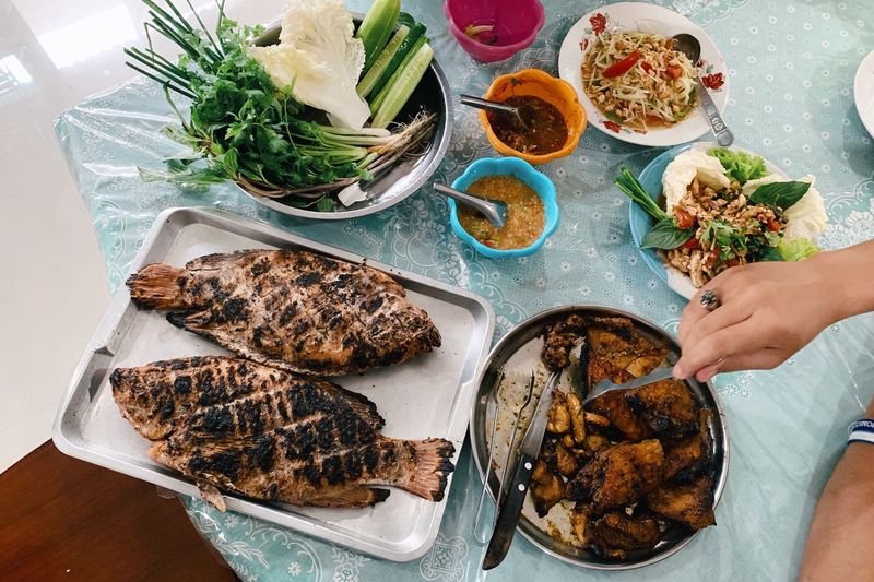 High angle view of person preparing thai food on table