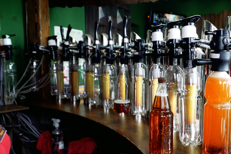 Row of wine bottles on bar counter