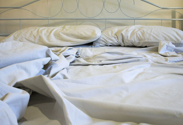 White sheet and pillows on bed
