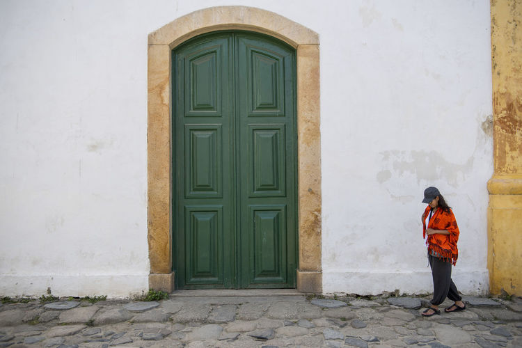 Woman walking through the streets of paraty in brazil
