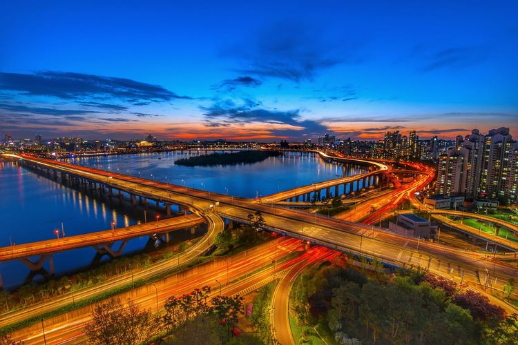 High angle view of light trails on road at night