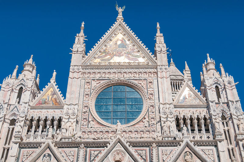 Close up of architectural details on facade of siena duomo, cathedral. siena, italy