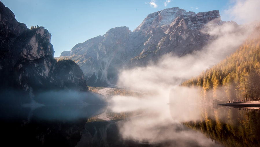 Majestic mountain range with water reflection