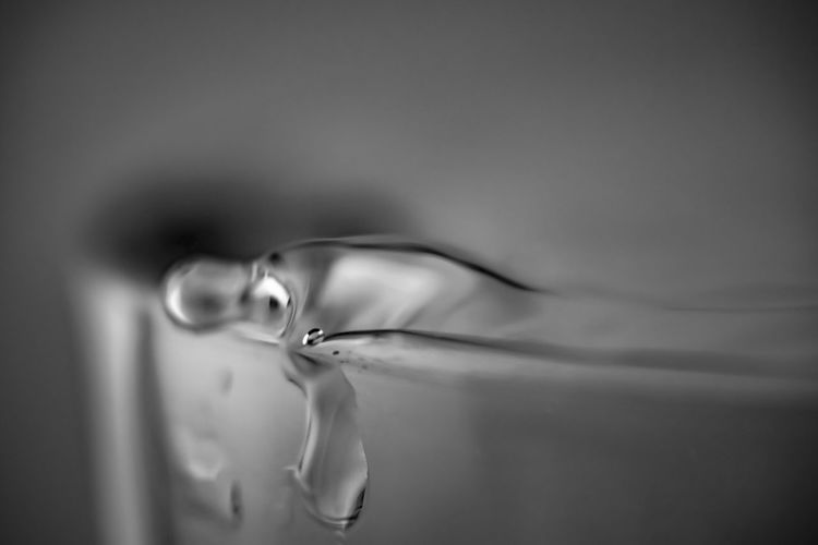 Close-up of water spilling from glass