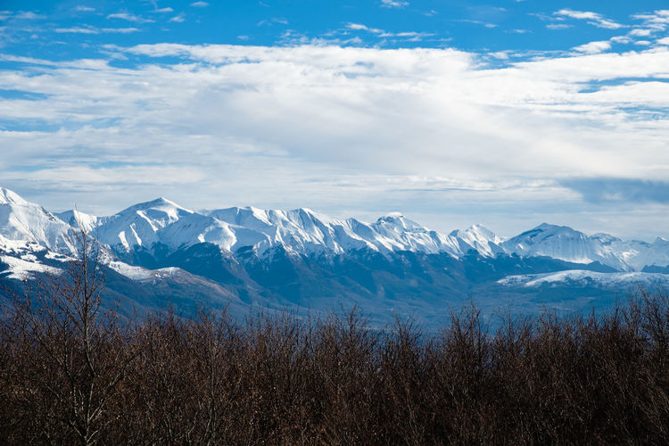 Scenic view of snowcapped mountains against sky in accumoli, lazio italy 