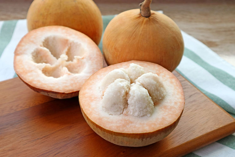Closeup an opened sweet and sour fresh ripe cotton fruit or santol fruit