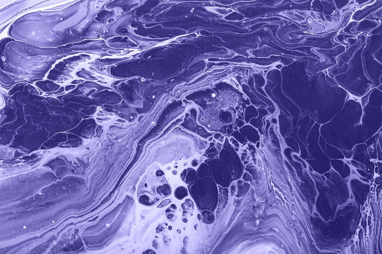 Fluid art. monochrome violet abstract waves. color of year 2022. marble effect background or texture