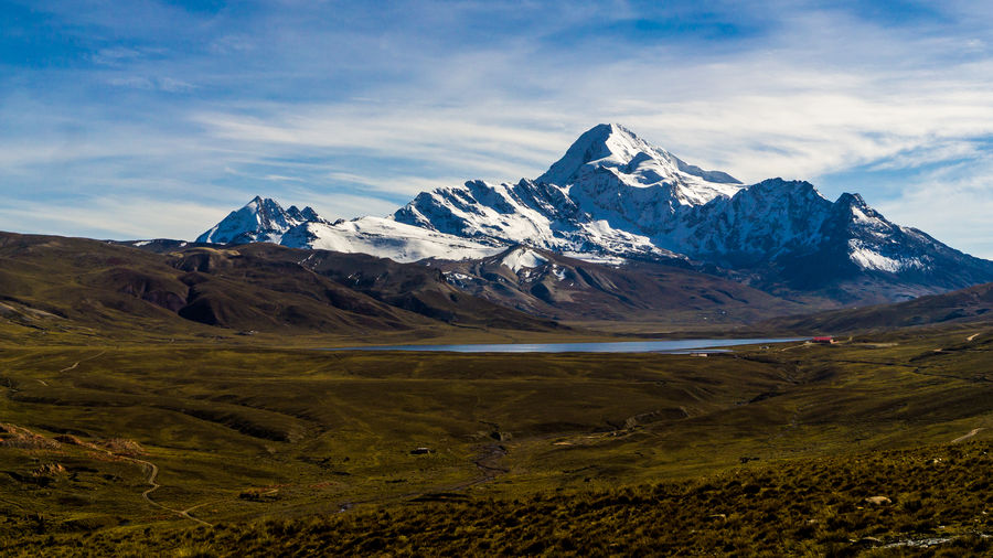 View of snowcapped mountain against cloudy sky