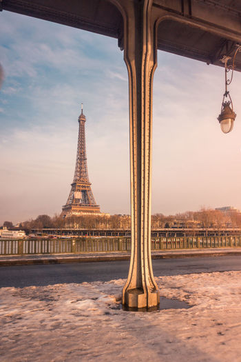 View from bridge on famous paris landmark and architectural sight eiffel tower in winter day