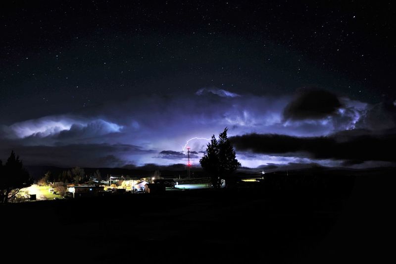 Scenic view of lightning against sky at night