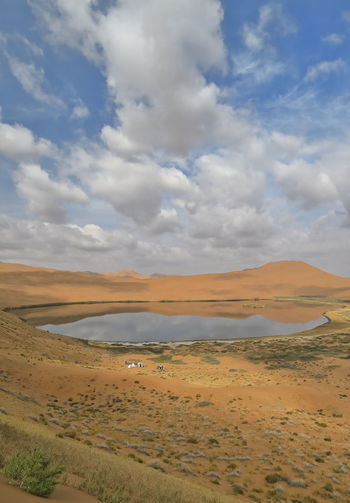1076 lake zhalate-badain jaran desert-nomadic yurts-dune and sky reflection. inner mongolia-china.