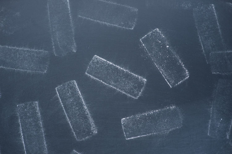 Close-up of chalk dust on blackboard
