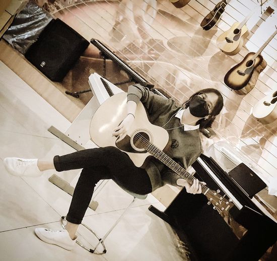 High angle view of guitar on table