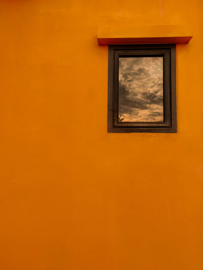 Low angle view of yellow orange sky