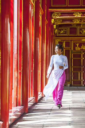 Beautiful woman exploring the imperial palace in hue / vietnam