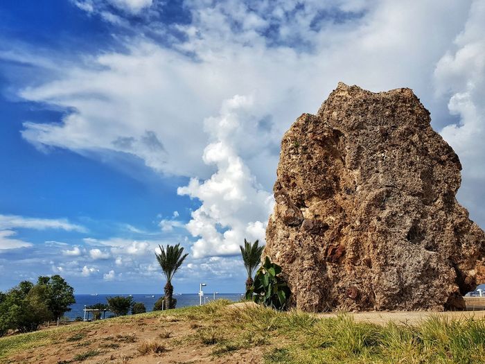 Rock formations on land against sky