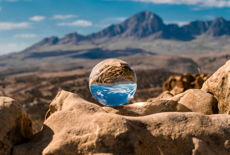 Scenic view of rock against sky