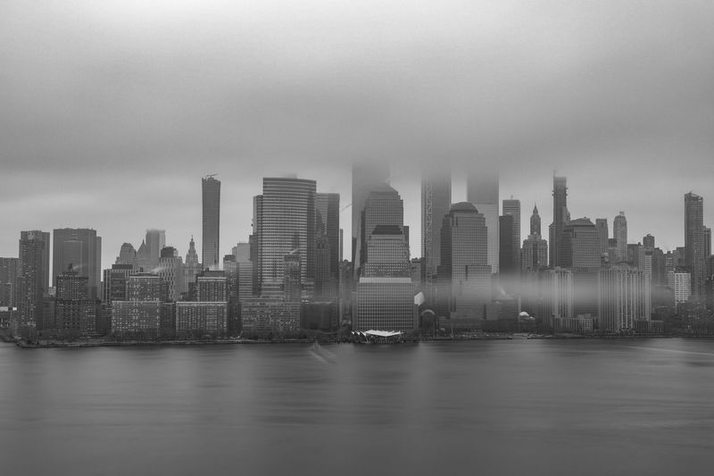 Modern buildings in city against sky