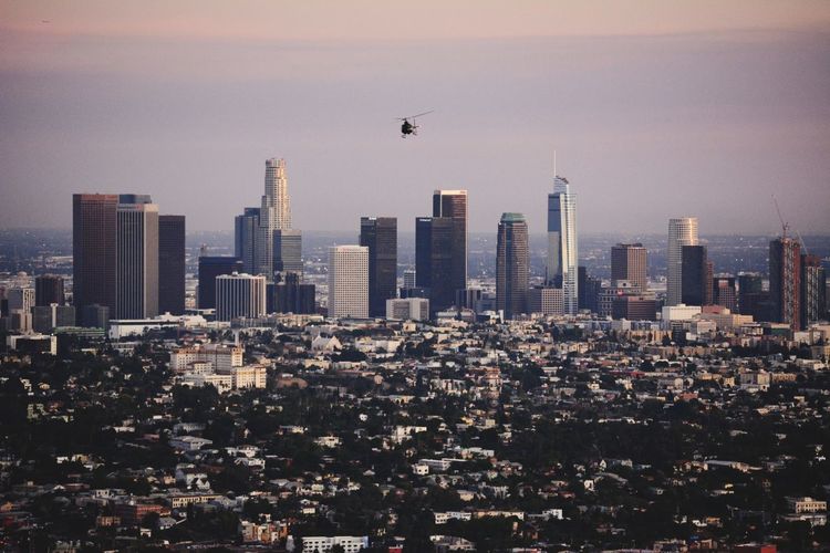 Aerial view of cityscape against sky