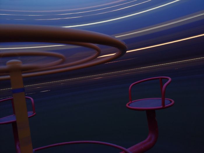 Close up spinning merry-go-round at night