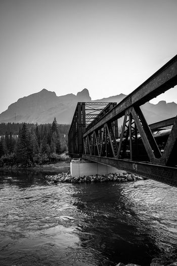 engine bridge in Canmore Blackandwhite Monochrome Country River Mountain Rocky Mountains Water Bridge - Man Made Structure Business Finance And Industry Steel Sky Architecture Built Structure Rail Transportation