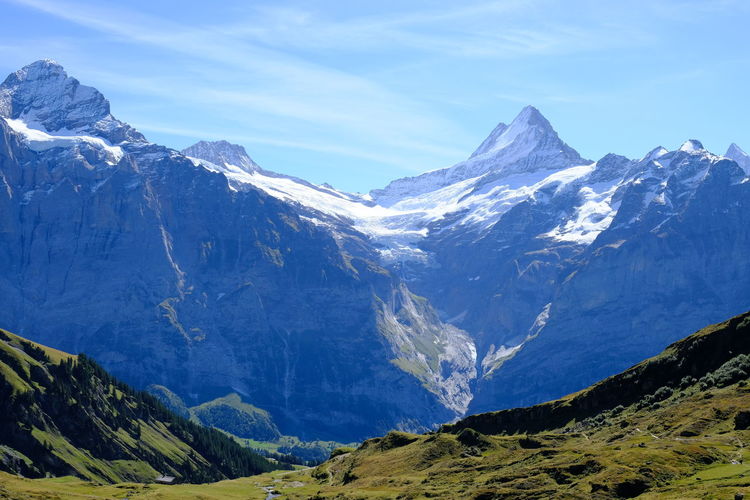 Scenic view of snowcapped mountains against sky