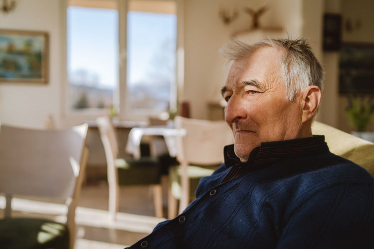 Man sitting on chair at home