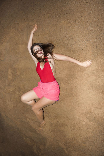 High angle view of woman jumping