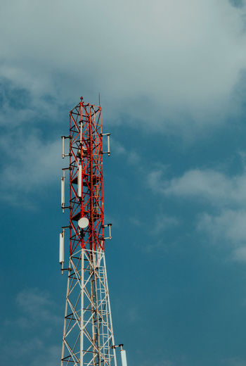 Low angle view of communications tower against sky.