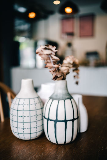 Close-up of vase on table at home