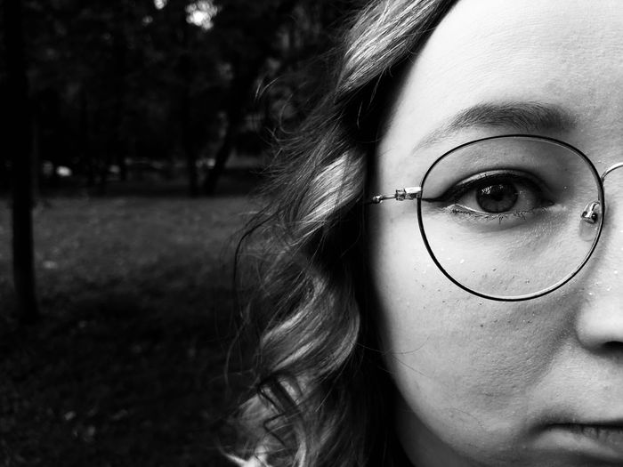Close-up portrait of woman with eyeglasses