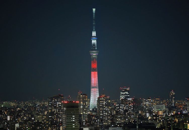 Illuminated tokyo sky tree in city against clear sky