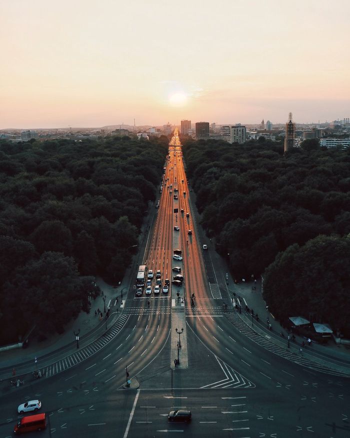 High angle view of traffic on road in city during sunset