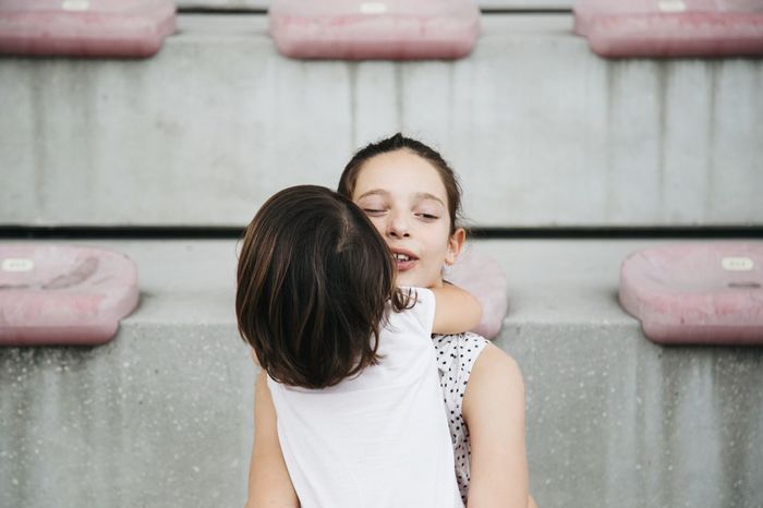 Portrait of two girls hugging