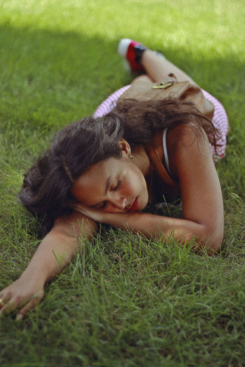 Young woman sleeping at park
