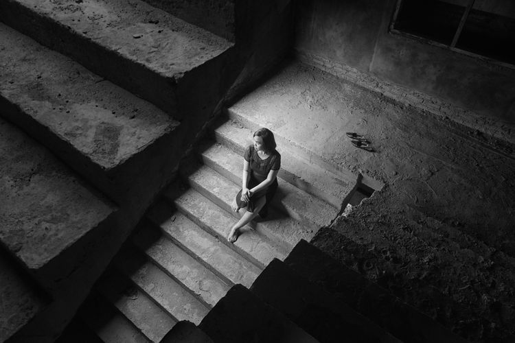High angle view of woman on staircase