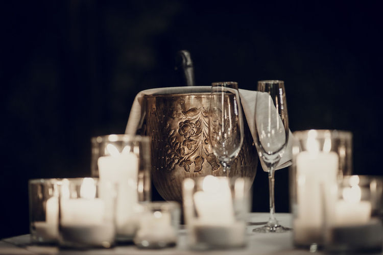 Close-up of glass on table and ice-bucket