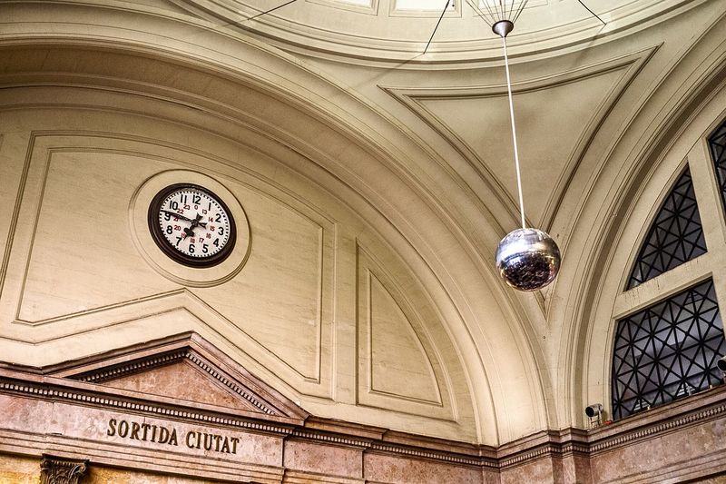 Low angle view of disco ball hanging in railroad station