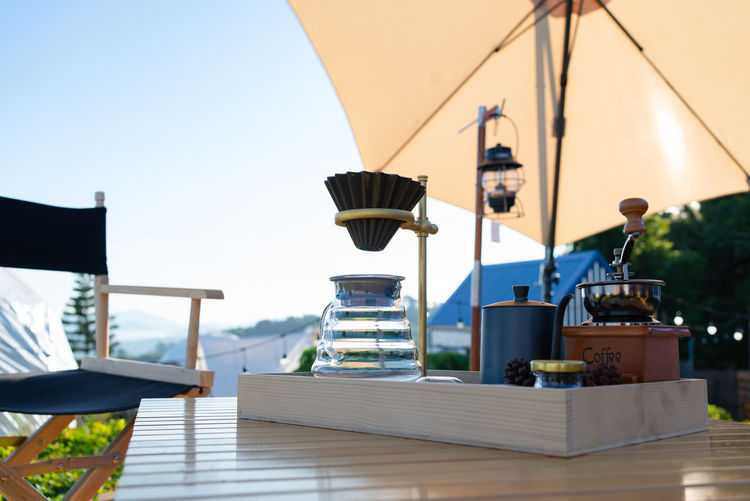 Low angle view of empty chairs against sky