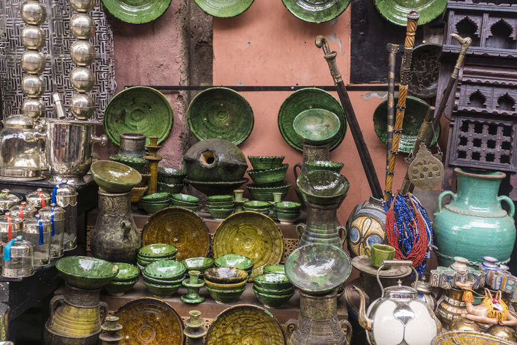 Exterior of souvenir shop in medina with green pottery