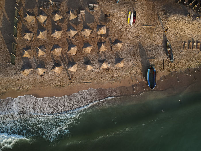 Aerial view of beach umbrellas on seashore