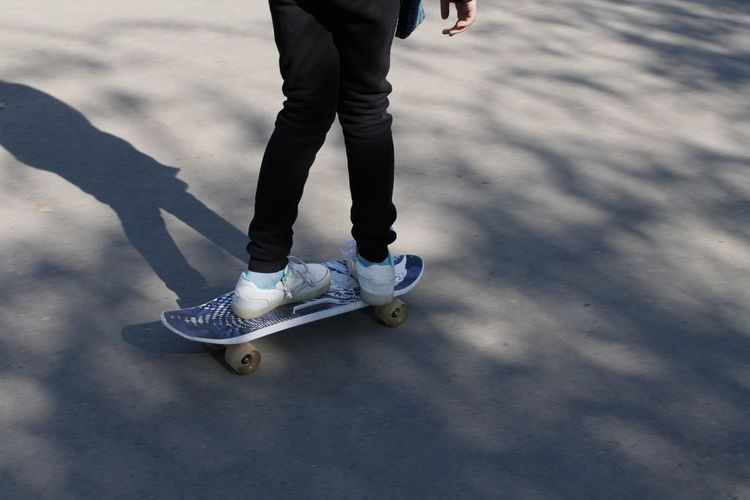 Low section of person skateboarding on skateboard