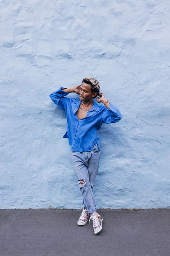 Full length of woman standing on road