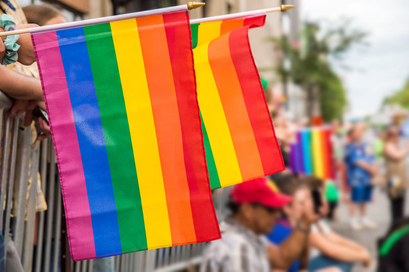 Close-up of multi colored flags hanging on clothesline