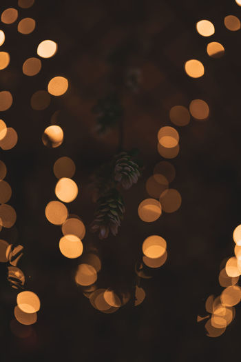 Defocused image of illuminated christmas tree at night