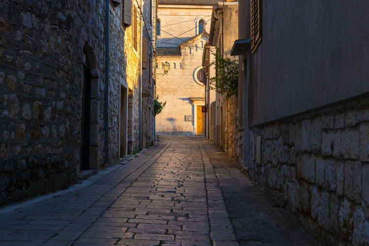 The narrow cobbled street of stari grad town on hvar island, croatia