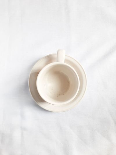 High angle view of empty coffee cup on table.