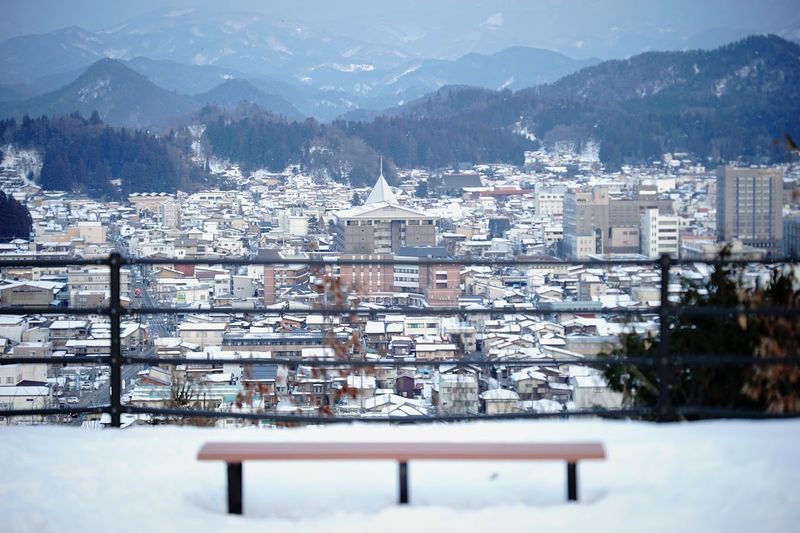 Aerial view of houses in city during winter